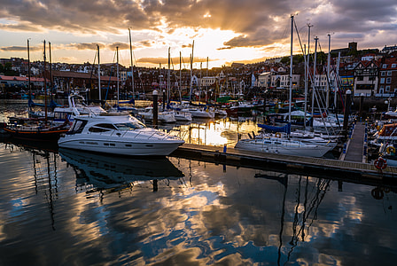photography of boats on pier at daytime thumbnail