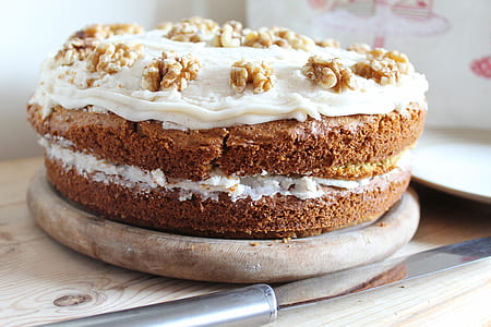 plate of cake with cream and nuts thumbnail