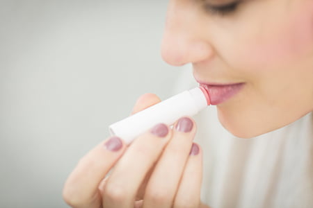 woman using lip balm thumbnail