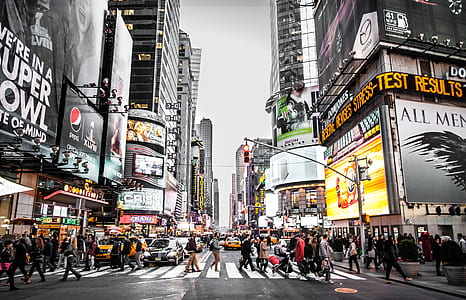 time lapse photography of people walking across Time Square, New York road thumbnail