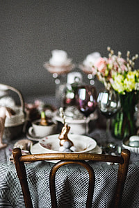 Round dinner table decorated with easter motifs thumbnail