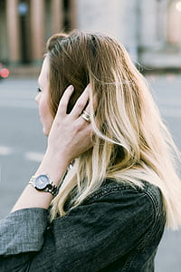 Brown Haired Woman Holding Her Hair thumbnail