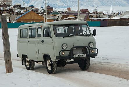 gray van on snow land thumbnail
