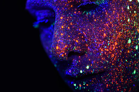 person's face with neon paints thumbnail
