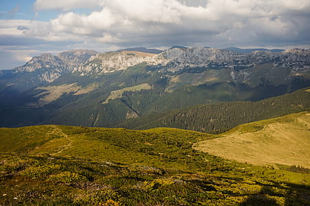 Green Mountain Range Under Cloudy Skies thumbnail
