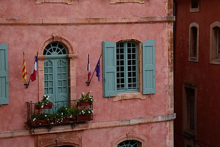 architectural photography of pink and blue house thumbnail