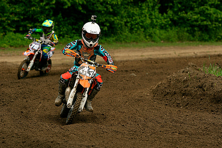 motor riders on mud racing road thumbnail