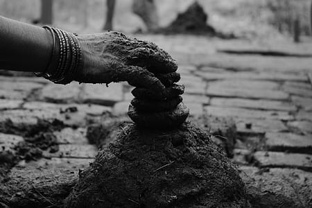 person holding soil thumbnail