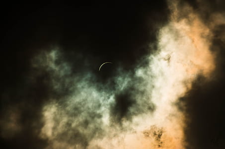 crescent moon covered with black clouds thumbnail
