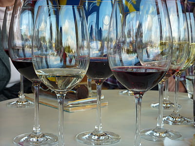 clear wine glasses on white table thumbnail