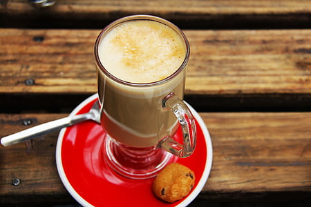 clear Irish glass on red saucer with beverage and cookie thumbnail