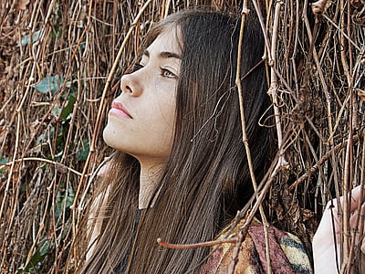 photo of woman behind tree thumbnail