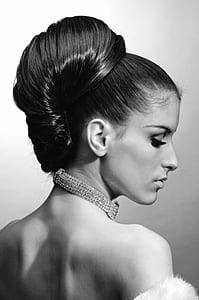 grayscale portrait photography of woman with bun hair thumbnail