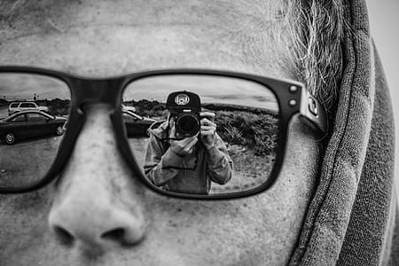 grayscale photo of man wearing sunglasses thumbnail
