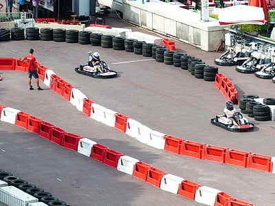 person riding go kart on track field thumbnail