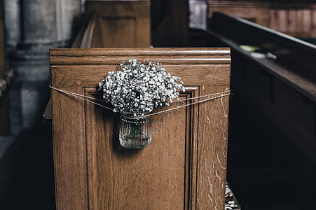 clear glass cup with artificial flower thumbnail
