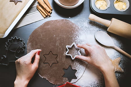 Woman prepares cookies in the black work board thumbnail
