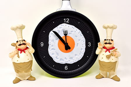 two chef figurines beside analog clock displaying 11:52 thumbnail