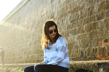 woman sitting on side walk thumbnail
