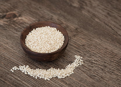 rice grains on wooden bowl thumbnail