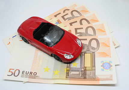 red convertible die-cast model and 50 Euro banknotes thumbnail