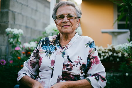woman in floral shirt while smiling thumbnail