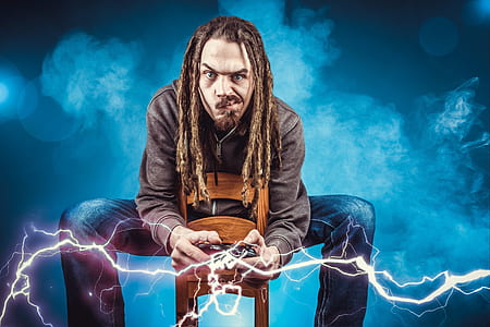 man holding game controller photo thumbnail