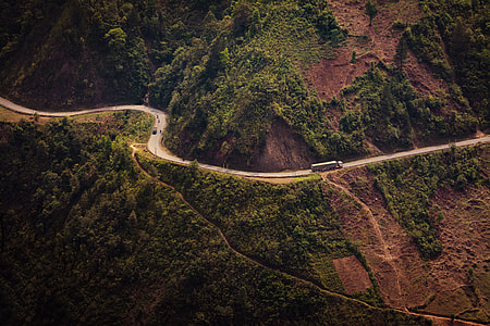 truck traveling on mountain road thumbnail