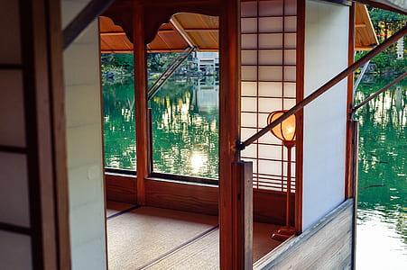 photo of open window house near body of water thumbnail