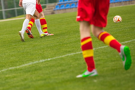 pair of red-and-yellow soccer socks thumbnail