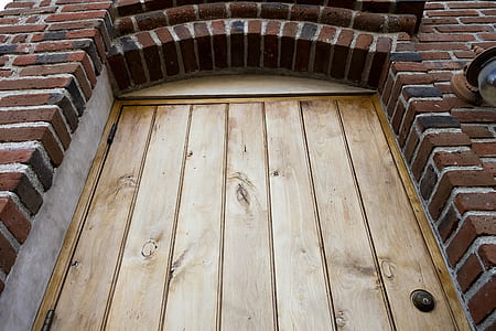closed brown wooden door thumbnail