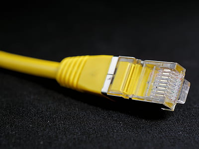 yellow ethernet cable on black surface thumbnail