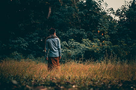 man standing on plain field thumbnail