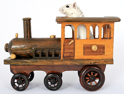 white mouse riding on brown wooden train toy thumbnail