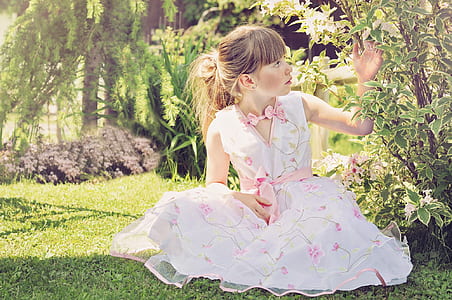 girl's white dress near trees thumbnail