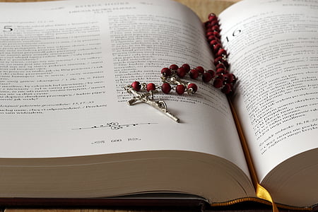 red rosary on bible page thumbnail