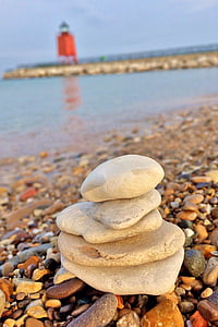 cairn near body of water thumbnail