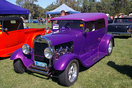 purple vehicle parked beside canopy tent at daytime thumbnail