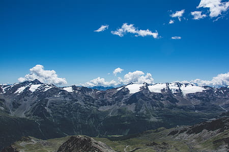 aerial view photography of mountain under blue sky thumbnail