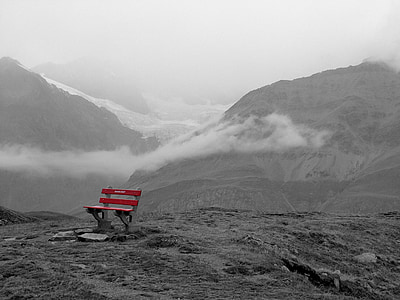 selective photography of red bench on the edge of mountain thumbnail