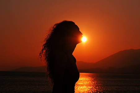 silhouette of woman during sunset thumbnail