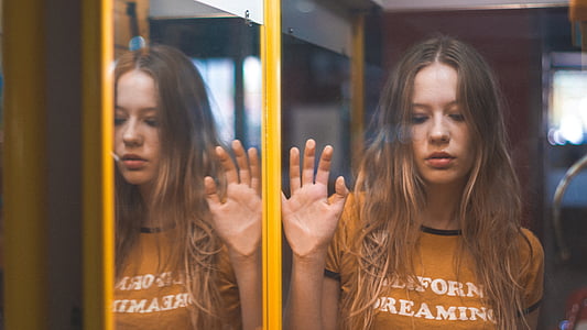 woman wearing orange crew-neck shirt thumbnail