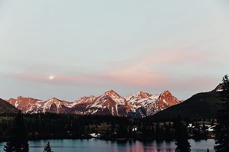 snow-capped mountain near body of water thumbnail