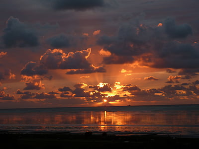body of water during sunset thumbnail