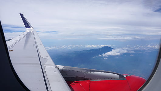airplane over landscape thumbnail