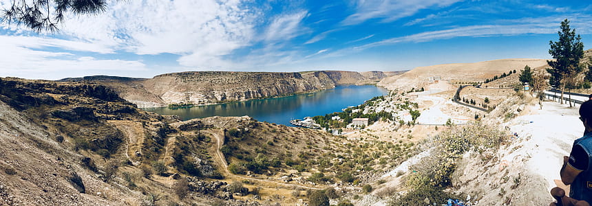 body of water near mountain thumbnail