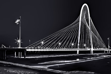 photo of flag of America near gray lighted bridge thumbnail