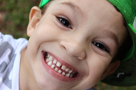boy wearing green cap thumbnail