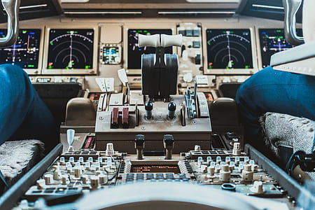 two pilot in airplane cockit controls thumbnail