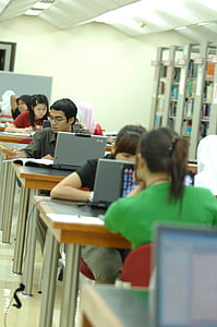 students with laptop on tables thumbnail